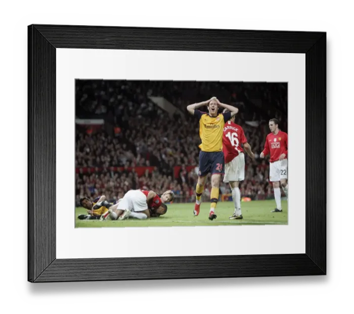 Framed Print : Nicklas Bendtner's Disappointment: Arsenal Trail Manchester United in UEFA Champions League Semi-Final
