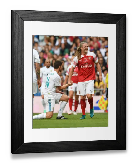 Framed Print : Clash of Football Legends: Emmanuel Petit vs. Xabi Alonso - Arsenal vs. Real Madrid (2018-19)