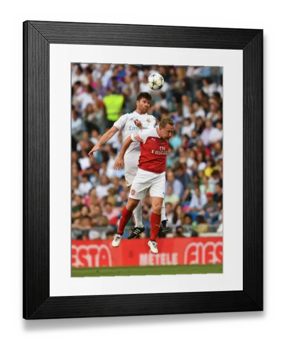 Framed Print : Clash of Football Legends: Arsenal vs. Real Madrid at Bernabeu (2018-19) - Ray Parlour vs. Xabi Alonso Framed Print : Clash of Football Legends: Arsenal vs. Real Madrid at Bernabeu (2018-19) - Ray Parlour vs. Xabi Alonso