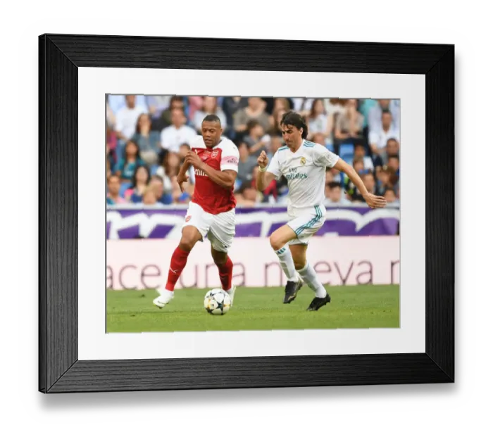 Framed Print : Arsenal vs. Real Madrid Legends Clash at Bernabeu (2018-19): A Battle of Football Greats