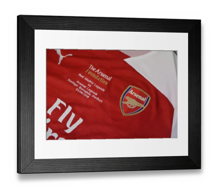 Framed Print : Arsenal Foundation: Preparing for Battle against Real Madrid Legends at Estadio Santiago Bernabeu