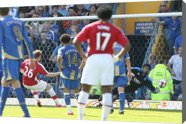 Nicklas Bendtner shoots past Portsmouth goalkeeper