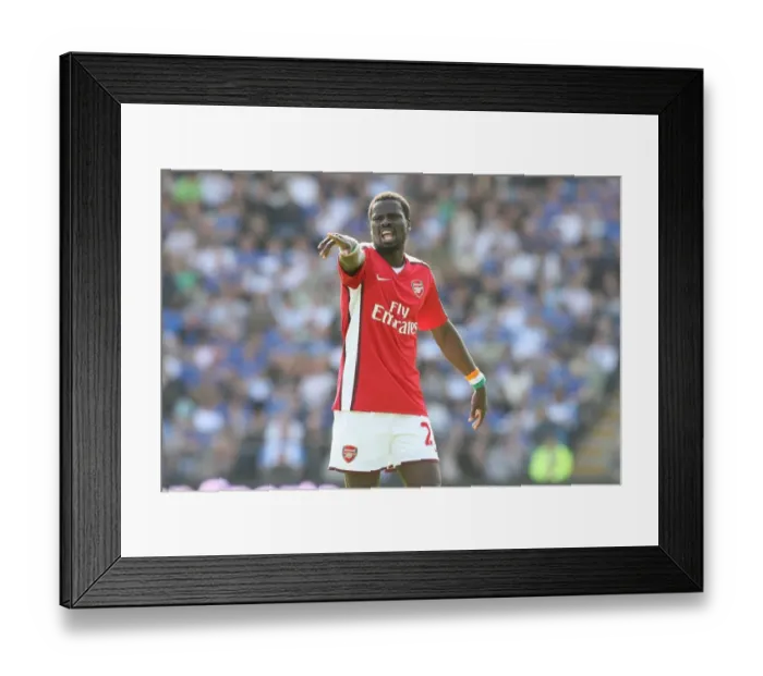 Framed Print : Eboue's Dominance: Arsenal Crushes Portsmouth 4-0, Emmanuel Eboue Shines