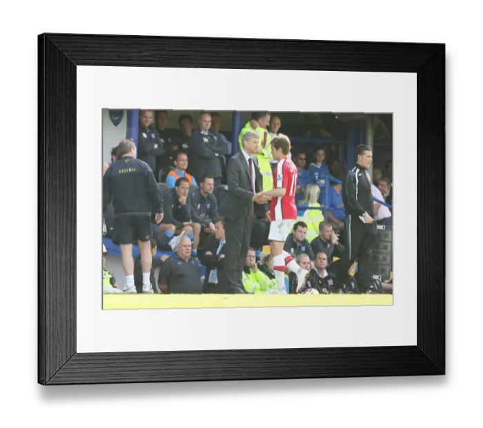 Framed Print : Arsenal manager Arsene Wenger shakes hands with Aaron