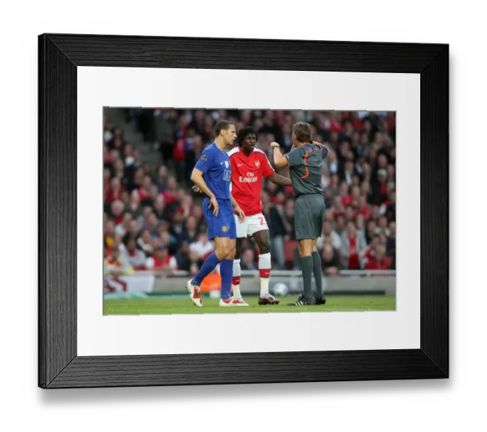Framed Print : Adebayor and Ferdinand's Contentious Chat: Arsenal vs. Manchester United in the UEFA Champions League Semi-Final Framed Print : Adebayor and Ferdinand's Contentious Chat: Arsenal vs. Manchester United in the UEFA Champions League Semi-Final