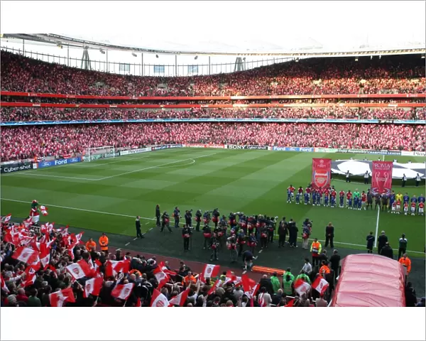 The Arsenal team line ups before the match as the fans