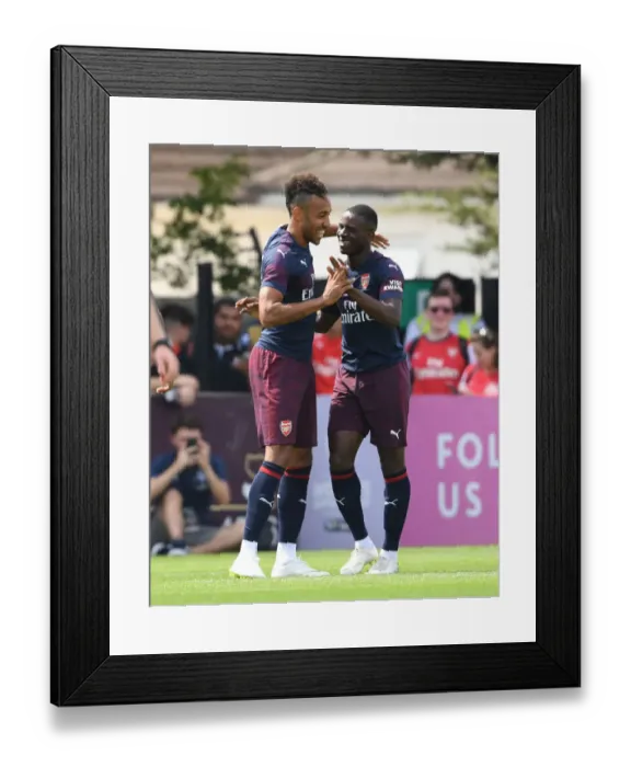 Framed Print : Arsenal Stars Pierre-Emerick Aubameyang and Jordi Osei-Tutu in Pre-Season Friendly against Borehamwood