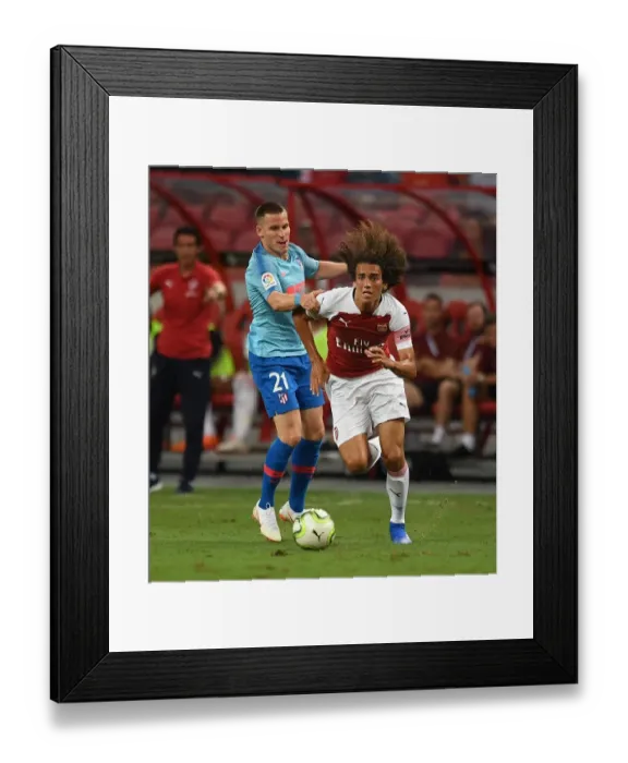 Framed Print : Guendouzi vs. Gameiro: Clash between Arsenal's Young Star and Atletico Madrid's Striker in 2018 International Champions Cup