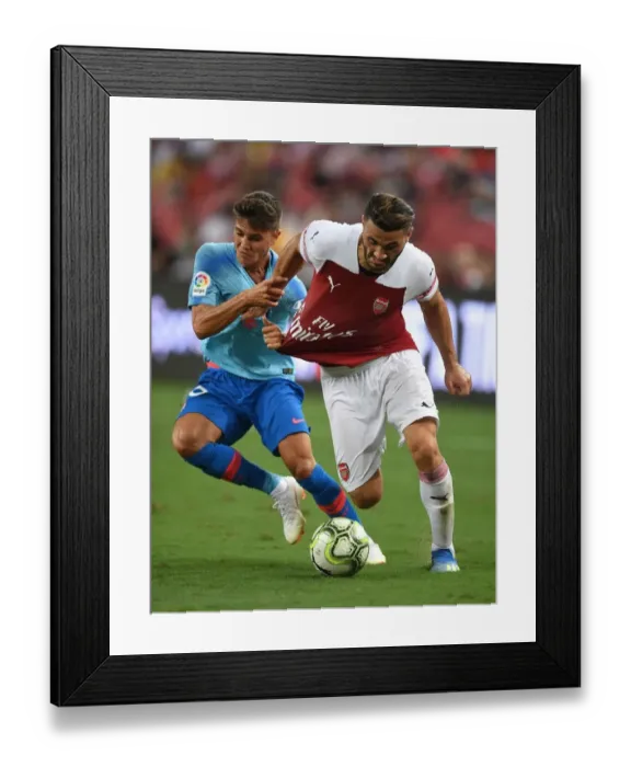 Framed Print : Clash of the Defenders: Sead Kolasinac vs. Oscar Pinchy - Arsenal vs. Atletico Madrid ICC 2018