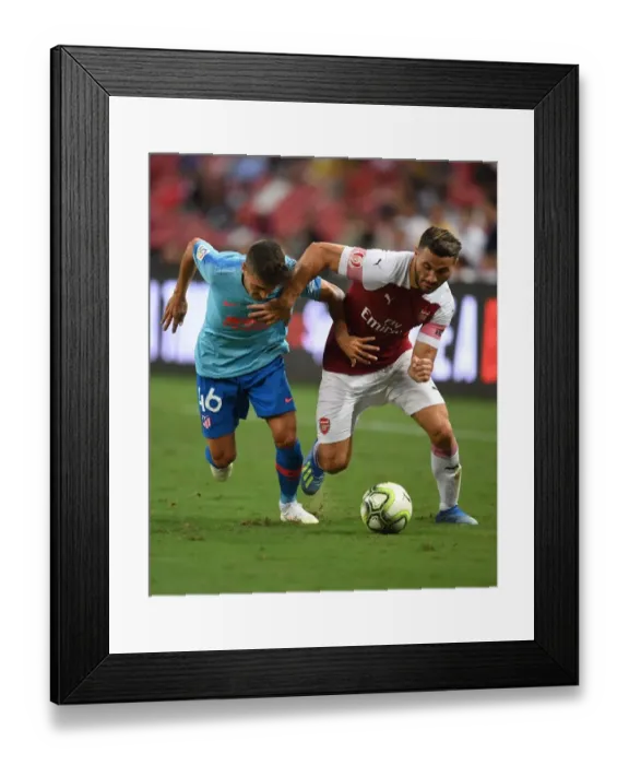 Framed Print : Sead Kolasinac vs. Oscar Pinchi: Clash at the International Champions Cup 2018 between Arsenal and Atletico Madrid Framed Print : Sead Kolasinac vs. Oscar Pinchi: Clash at the International Champions Cup 2018 between Arsenal and Atletico Madrid