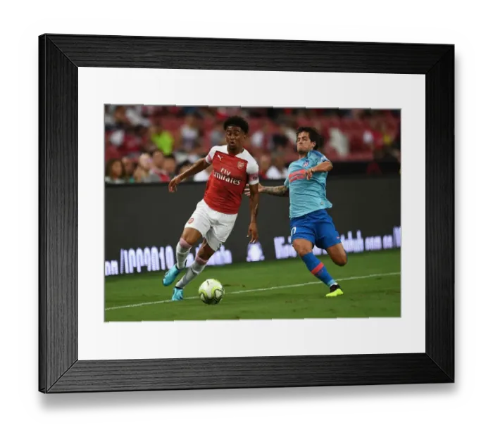 Framed Print : Reiss Nelson vs. Mikel Carro: Clash at the International Champions Cup 2018 between Arsenal and Atletico Madrid