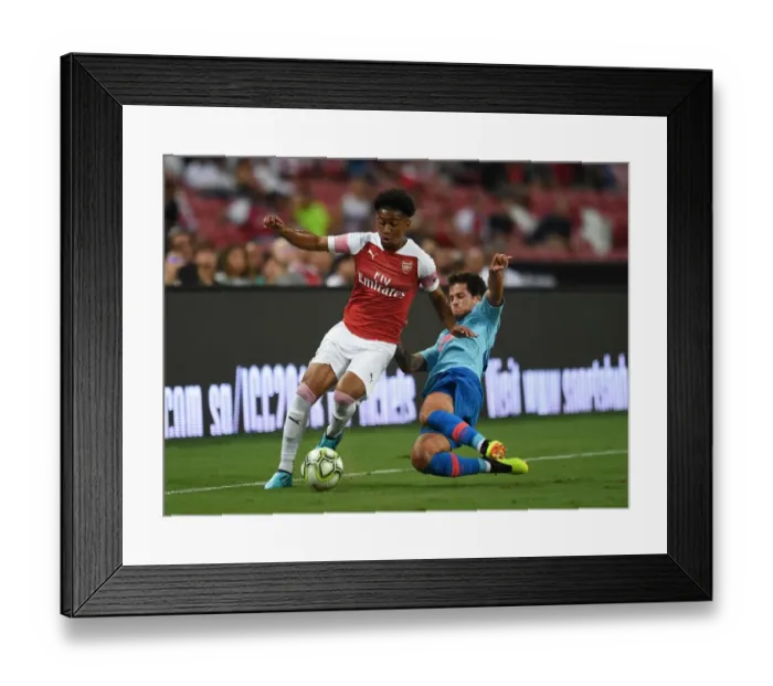 Framed Print : Reiss Nelson vs Mikel Carro: Clash between Arsenal and Atletico Madrid at the International Champions Cup 2018