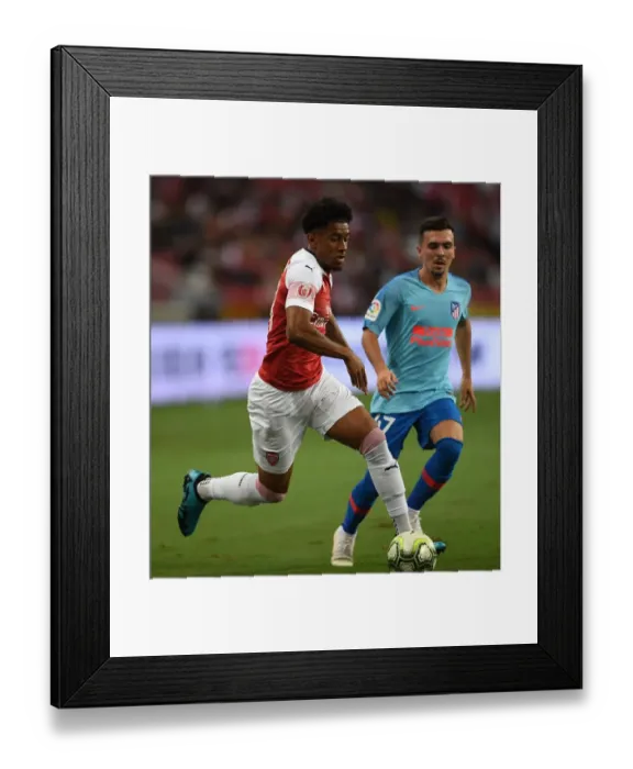 Framed Print : Reiss Nelson vs. Joaquin Munoz: Clash between Arsenal and Atletico Madrid in 2018 International Champions Cup