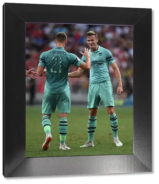 Arsenal's Rob Holding and Calum Chambers Celebrate Goal Against Paris Saint-Germain in 2018 International Champions Cup