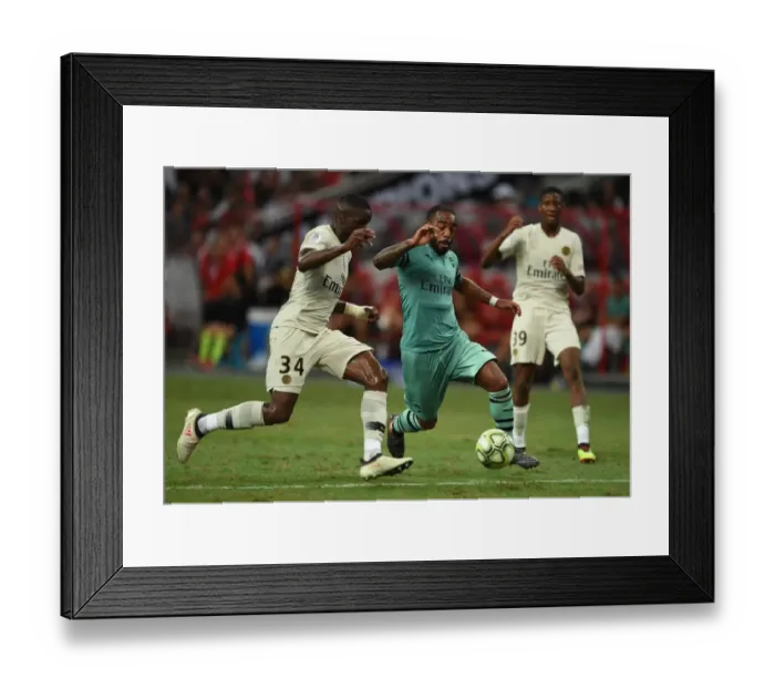 Framed Print : Clash of Stars: Lacazette vs. Nsoki in Arsenal's Battle Against PSG Framed Print : Clash of Stars: Lacazette vs. Nsoki in Arsenal's Battle Against PSG