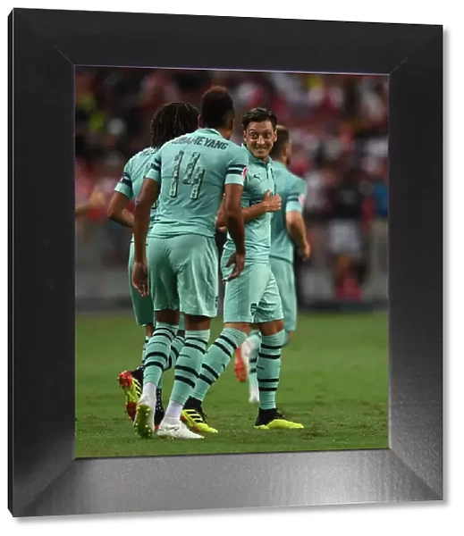 Arsenal Stars Ozil and Aubameyang Celebrate Goal Against Paris Saint-Germain, 2018
