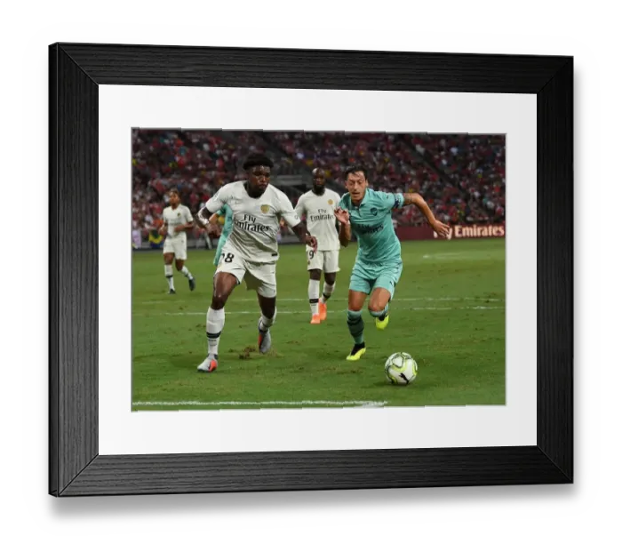 Framed Print : Ozil vs. Mbe Soh: Clash of the Stars in Arsenal vs. PSG ICC 2018