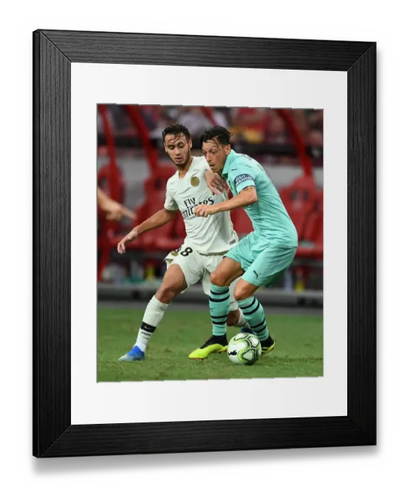 Framed Print : Arsenal vs. Paris Saint-Germain: Mesut Ozil Clashes with Azzedine Toufiqui in International Champions Cup 2018
