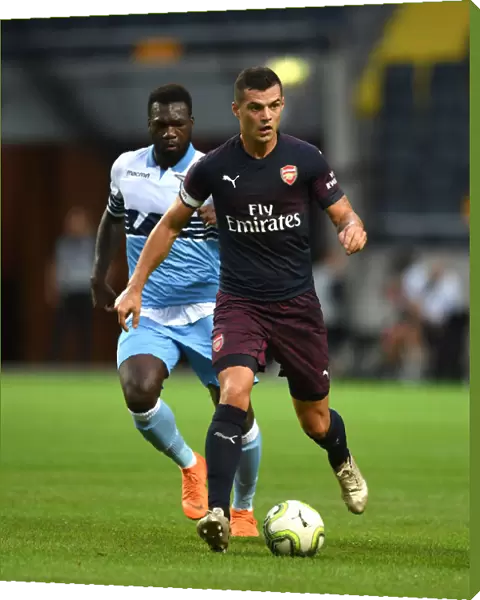 Arsenal's Granit Xhaka Clashes with Lazio's Felipe Caicedo in 2018 Pre-Season Friendly