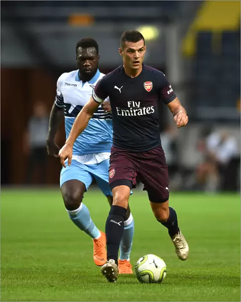 Arsenal's Granit Xhaka Clashes with Lazio's Felipe Caicedo in 2018 Pre-Season Friendly