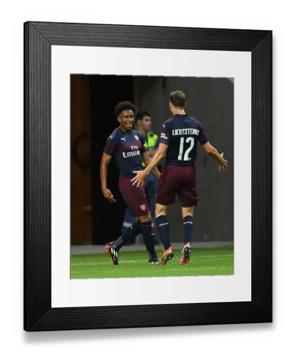 Framed Print : Arsenal's Reiss Nelson and Stephan Lichtsteiner Celebrate Goal Against SS Lazio in Stockholm Pre-Season Friendly, 2018 Framed Print : Arsenal's Reiss Nelson and Stephan Lichtsteiner Celebrate Goal Against SS Lazio in Stockholm Pre-Season Friendly, 2018