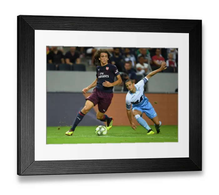 Framed Print : Arsenal's Matteo Guendouzi Outmaneuvers Lazio's Luiz Felipe in Stockholm Friendly