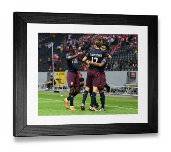 Framed Print : Arsenal's Reiss Nelson, Eddie Nketiah, and Stephan Lichtsteiner Celebrate Goal Against SS Lazio in 2018 Pre-Season Friendly Framed Print : Arsenal's Reiss Nelson, Eddie Nketiah, and Stephan Lichtsteiner Celebrate Goal Against SS Lazio in 2018 Pre-Season Friendly