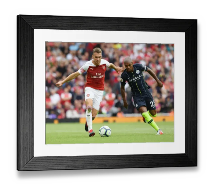 Framed Print : Arsenal's Aaron Ramsey Outmaneuvers Manchester City's Fernandinho in Premier League Showdown