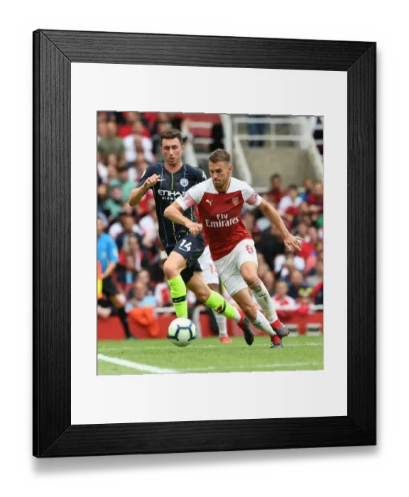 Framed Print : Arsenal's Ramsey Clashes with Manchester City's Laporte in Premier League Showdown