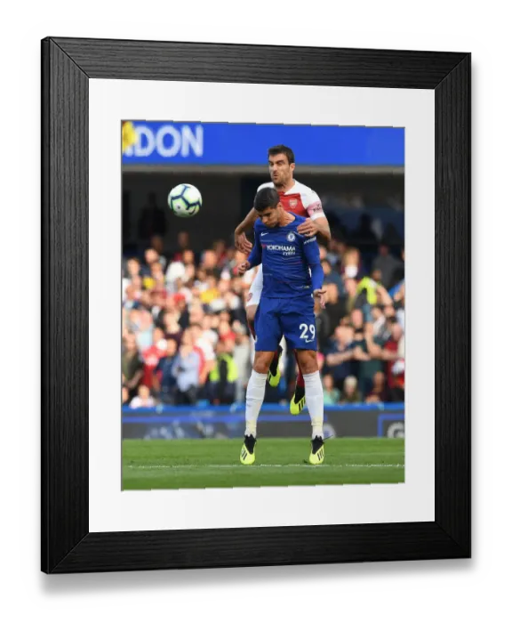 Framed Print : Clash at Stamford Bridge: Sokratis vs Morata - Premier League Showdown Framed Print : Clash at Stamford Bridge: Sokratis vs Morata - Premier League Showdown