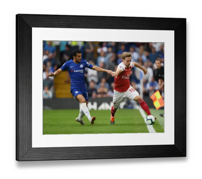 Framed Print : Monreal vs Pedro: A Football Rivalry Ignites at Stamford Bridge Framed Print : Monreal vs Pedro: A Football Rivalry Ignites at Stamford Bridge