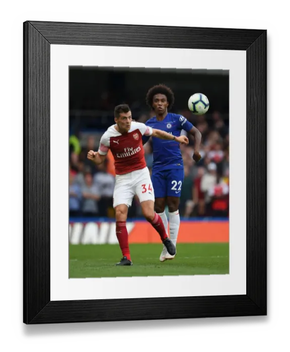 Framed Print : Clash at Stamford Bridge: Xhaka vs. Willian - Premier League Showdown Framed Print : Clash at Stamford Bridge: Xhaka vs. Willian - Premier League Showdown