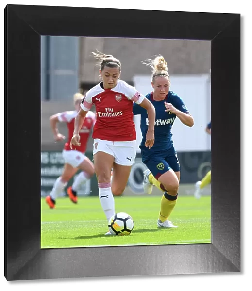 Arsenal's Katie McCabe Clashes with West Ham's Lucienne Reichardt in Continental Cup Match