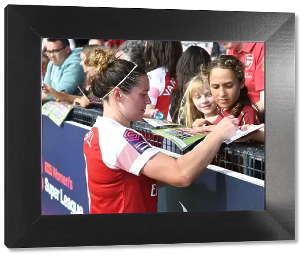 Emma Mitchell Signs for Fans after Arsenal Women's Continental Cup Match vs West Ham United Women