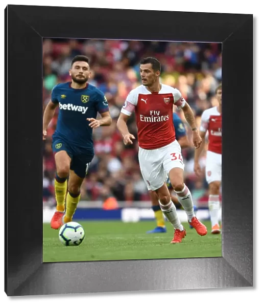 Granit Xhaka: Arsenal's Midfield Maestro in Action Against West Ham United, Premier League 2018-19