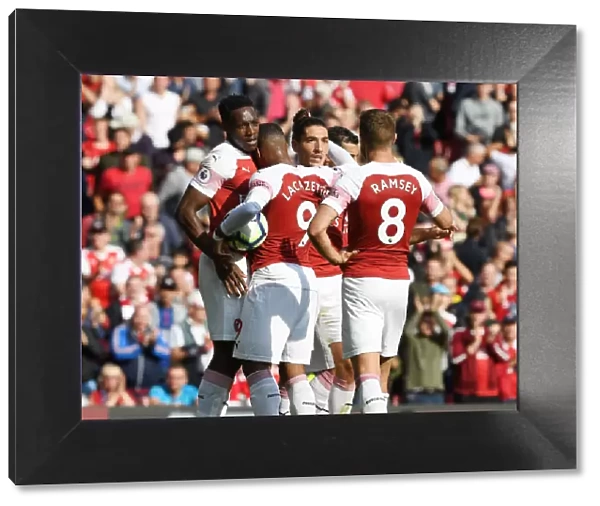 Arsenal's Winning Moment: Welbeck, Lacazette, Bellerin, and Ramsey Celebrate Goals Against West Ham United