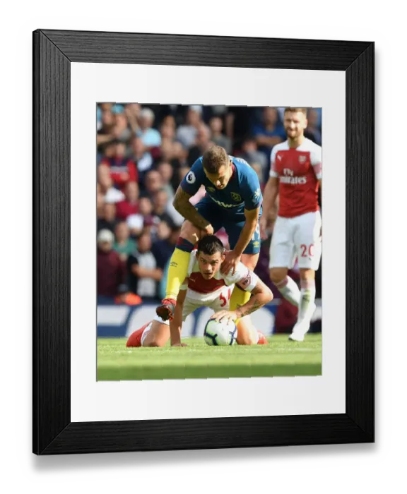 Framed Print : Clash of Midfield Titans: Xhaka vs. Wilshere - Arsenal v West Ham United, Premier League Framed Print : Clash of Midfield Titans: Xhaka vs. Wilshere - Arsenal v West Ham United, Premier League