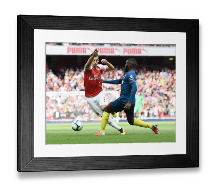 Framed Print : Clash at the Emirates: Mkhitaryan vs Masuaku in Arsenal's Battle Against West Ham Framed Print : Clash at the Emirates: Mkhitaryan vs Masuaku in Arsenal's Battle Against West Ham