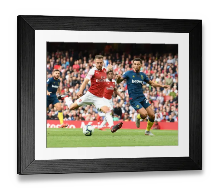 Framed Print : Arsenal's Aaron Ramsey Clashes with West Ham's Ryan Fredericks in Premier League Showdown Framed Print : Arsenal's Aaron Ramsey Clashes with West Ham's Ryan Fredericks in Premier League Showdown