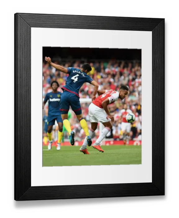 Framed Print : Clash at the Emirates: Aubameyang vs. Fredericks in Arsenal's Battle Against West Ham