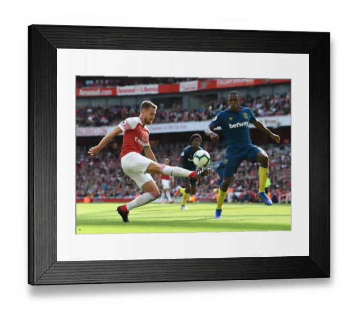 Framed Print : Arsenal's Ramsey Faces Off Against West Ham's Diop in Premier League Clash Framed Print : Arsenal's Ramsey Faces Off Against West Ham's Diop in Premier League Clash