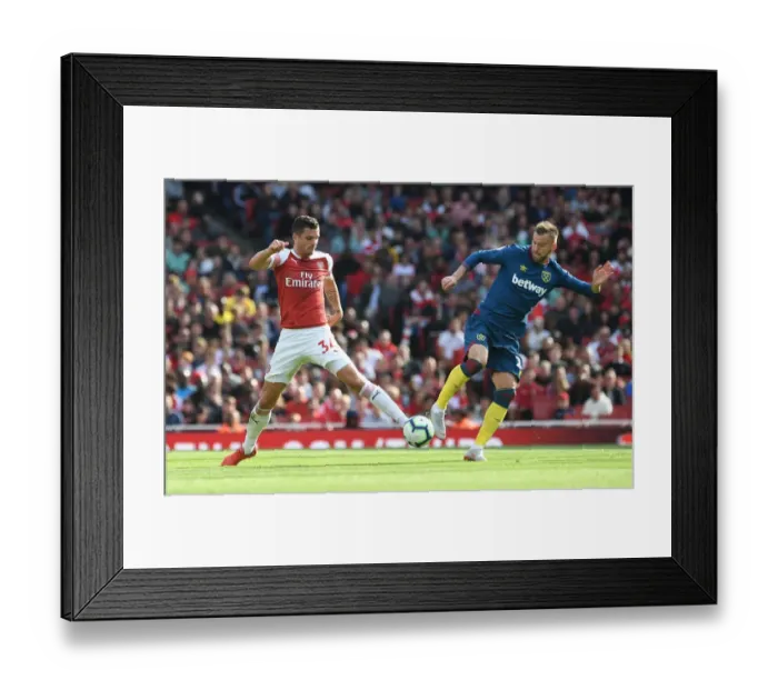 Framed Print : Clash at the Emirates: Xhaka vs. Yarmolenko in Premier League Showdown