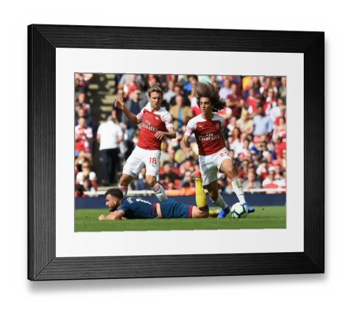 Framed Print : Arsenal's Guendouzi Clashes with West Ham's Snodgrass in Premier League Showdown