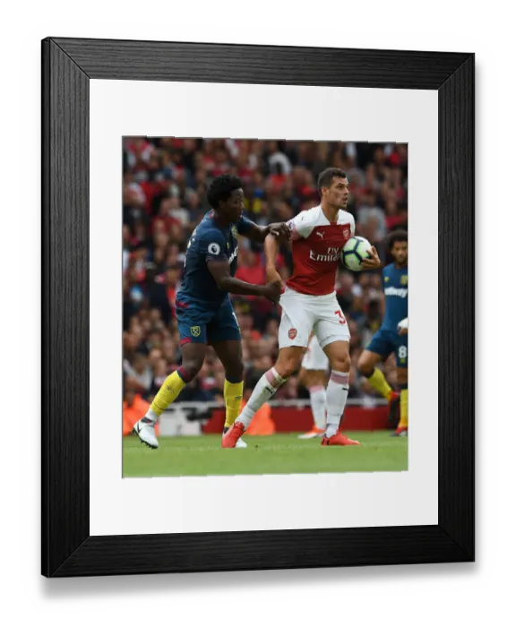 Framed Print : Xhaka vs Sanchez: Intense Clash Between Arsenal's Granit Xhaka and West Ham's Carlos Sanchez in the Premier League Framed Print : Xhaka vs Sanchez: Intense Clash Between Arsenal's Granit Xhaka and West Ham's Carlos Sanchez in the Premier League