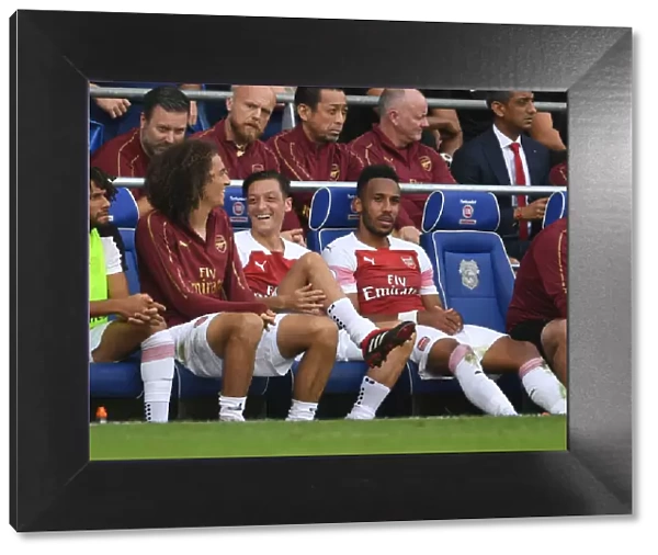 Arsenal's Ozil, Guendouzi, and Aubameyang in Action against Cardiff City