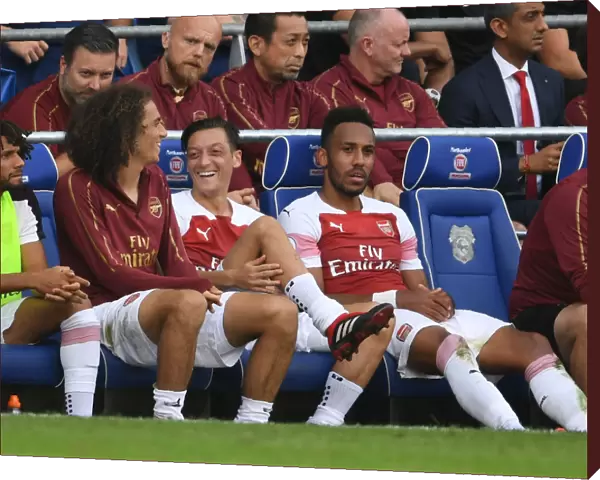 Arsenal's Ozil, Guendouzi, and Aubameyang in Action against Cardiff City