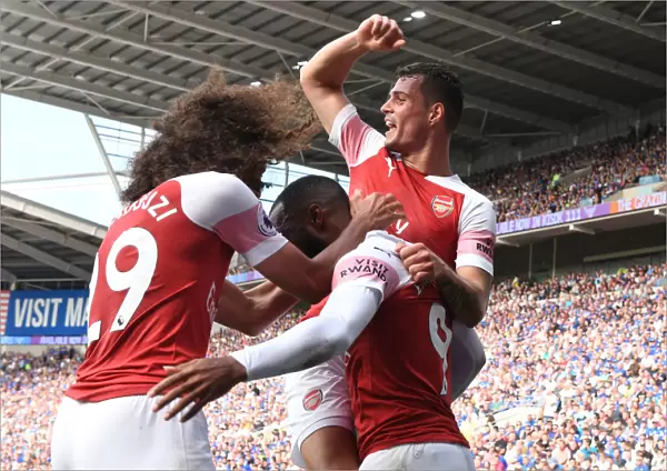 Arsenal's Xhaka, Lacazette, and Guendouzi Celebrate Goals Against Cardiff City