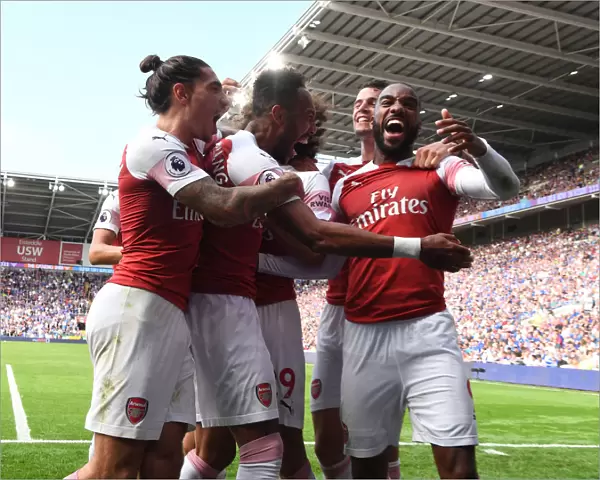 Arsenal Triumph: Aubameyang, Bellerin, and Lacazette Celebrate Goals Against Cardiff City