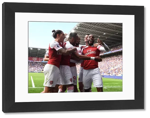 Arsenal Triumph: Aubameyang, Bellerin, and Lacazette Celebrate Goals Against Cardiff City
