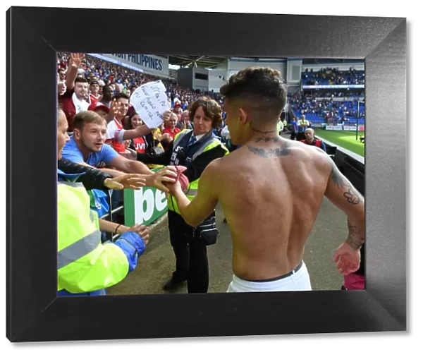 Lucas Torreira's Heartfelt Gesture: Arsenal Star Gives Shirt to Ecstatic Fan at Cardiff City